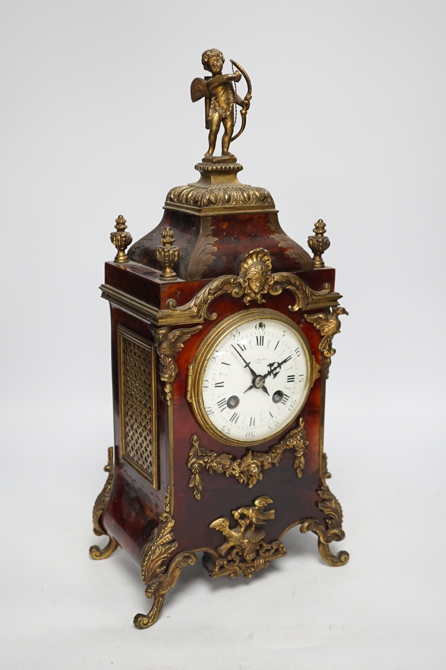 A late 19th century French tortoiseshell veneered mantel clock with cupid top, striking on a coiled gong, dial signed Benson, London, 39.5cm